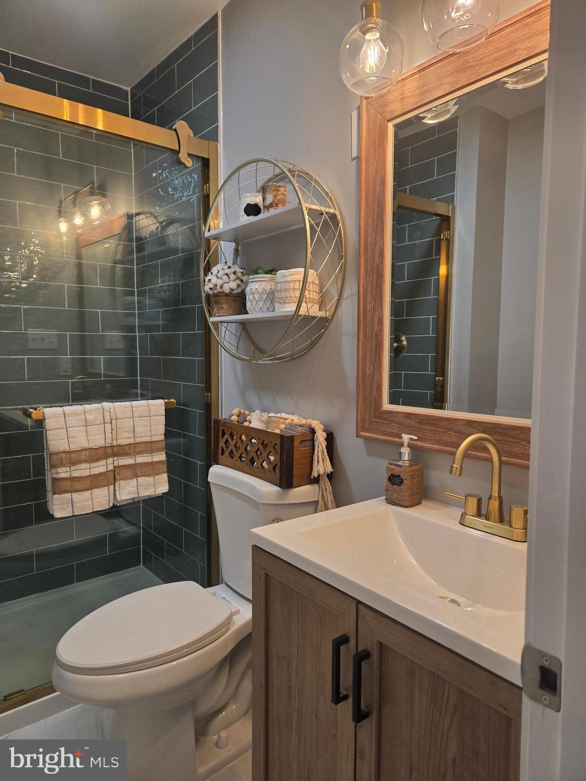 975 Williams Street Cumberland, MD 21502 - Photo 14 of 33 a bathroom with a sink a toilet and shower