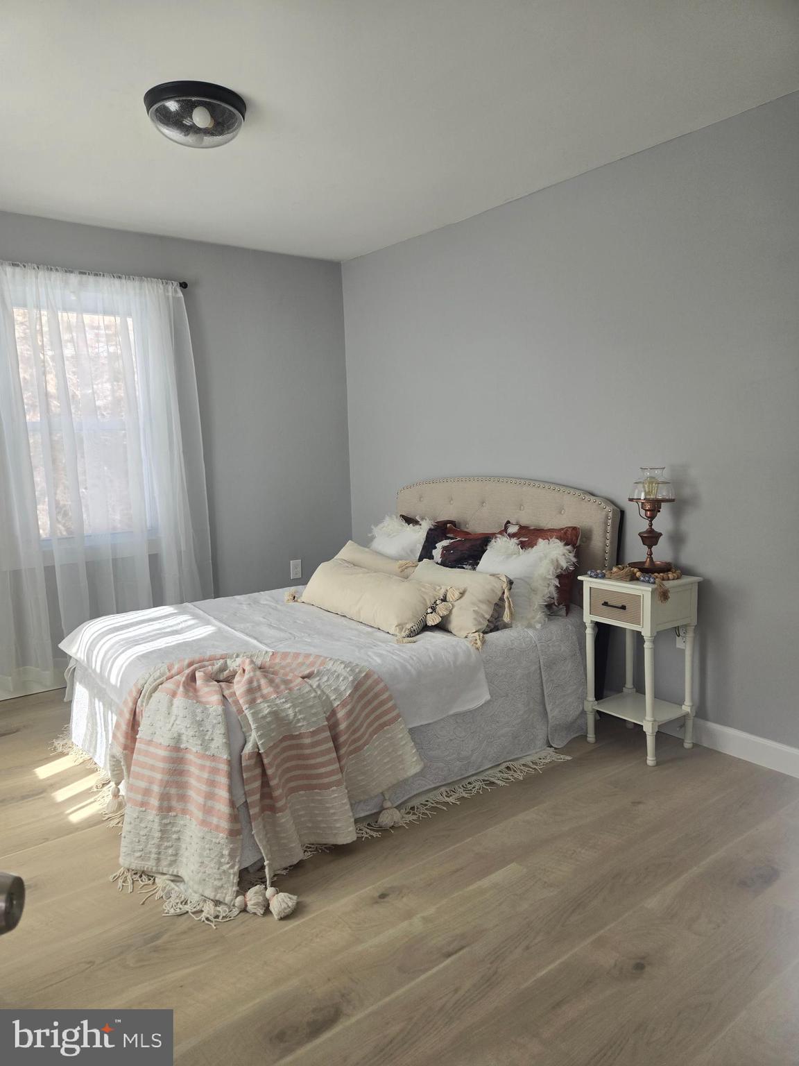 975 Williams Street Cumberland, MD 21502 - Photo 19 of 33 a bedroom with a bed and a window