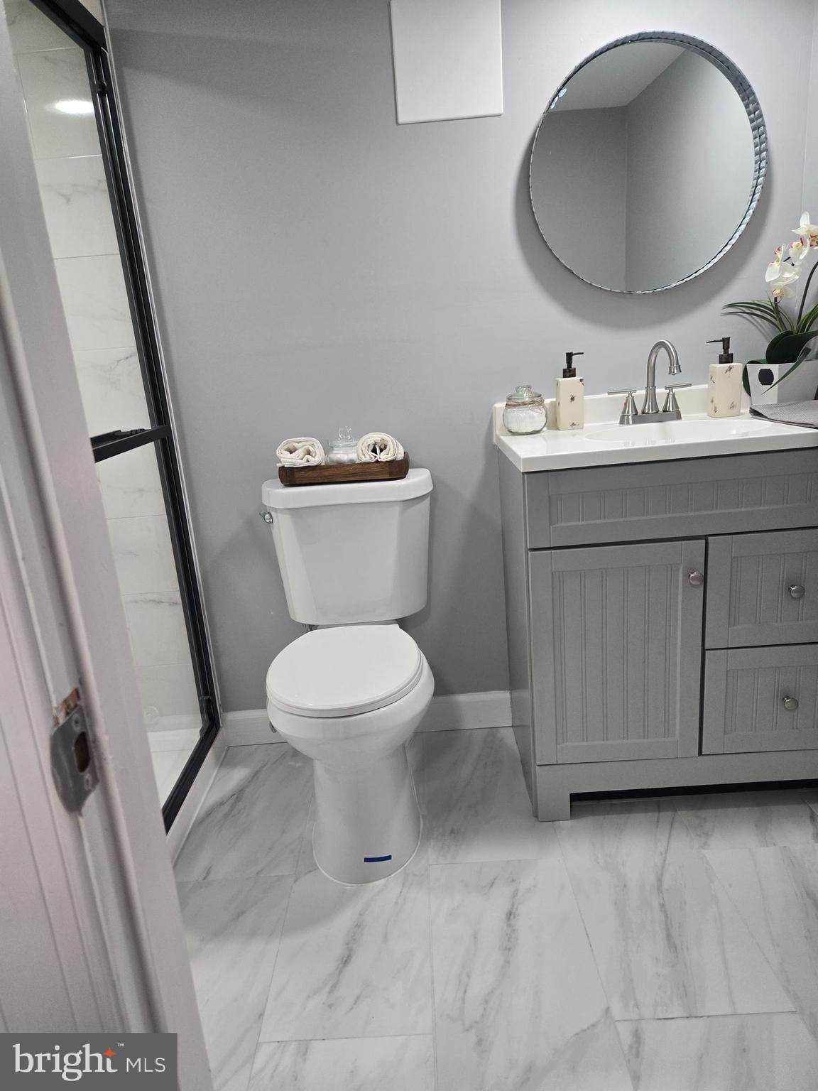 975 Williams Street Cumberland, MD 21502 - Photo 24 of 33 a bathroom with a toilet sink and mirror
