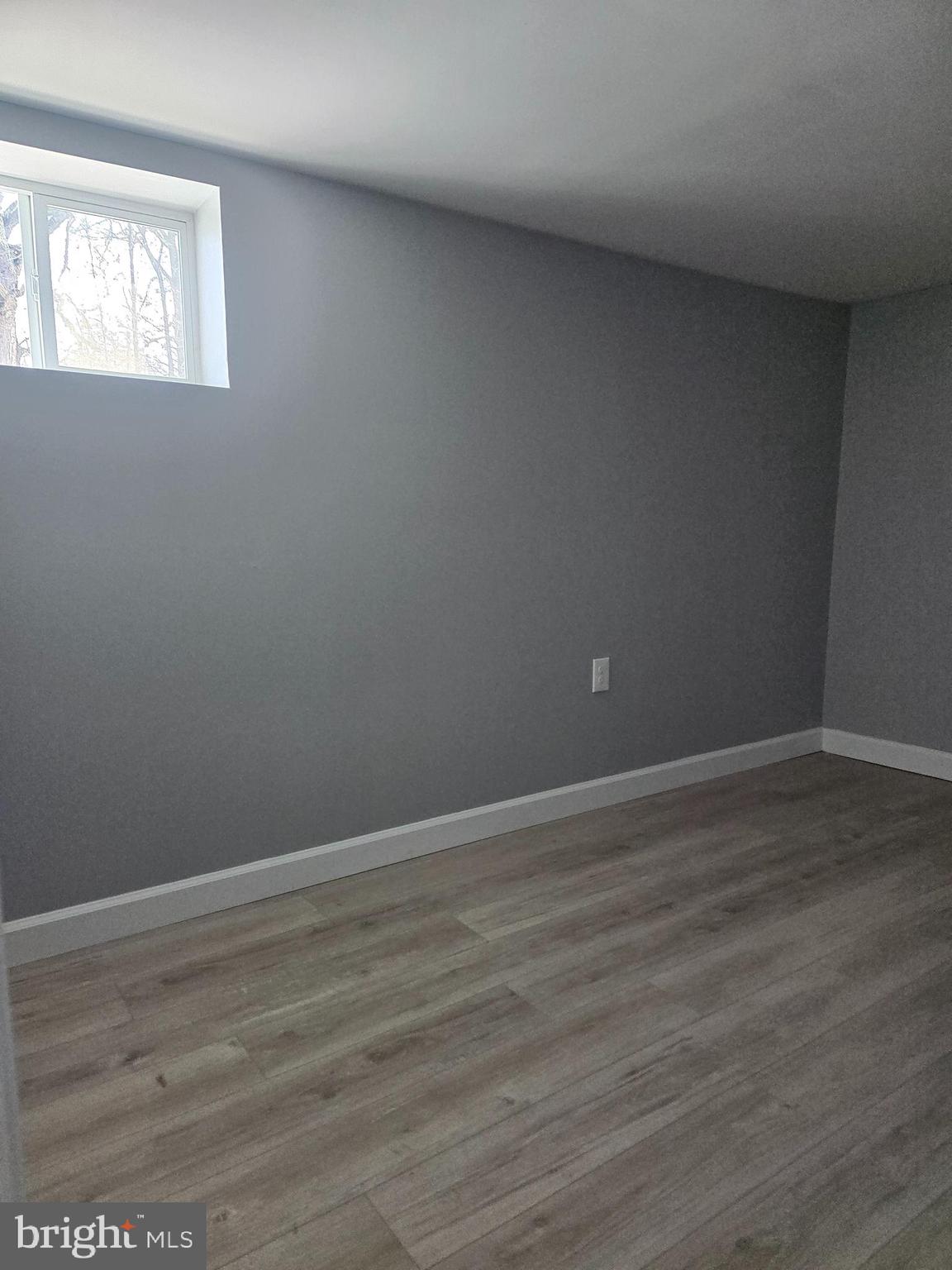 975 Williams Street Cumberland, MD 21502 - Photo 28 of 33 a view of an empty room with wooden floor and a window