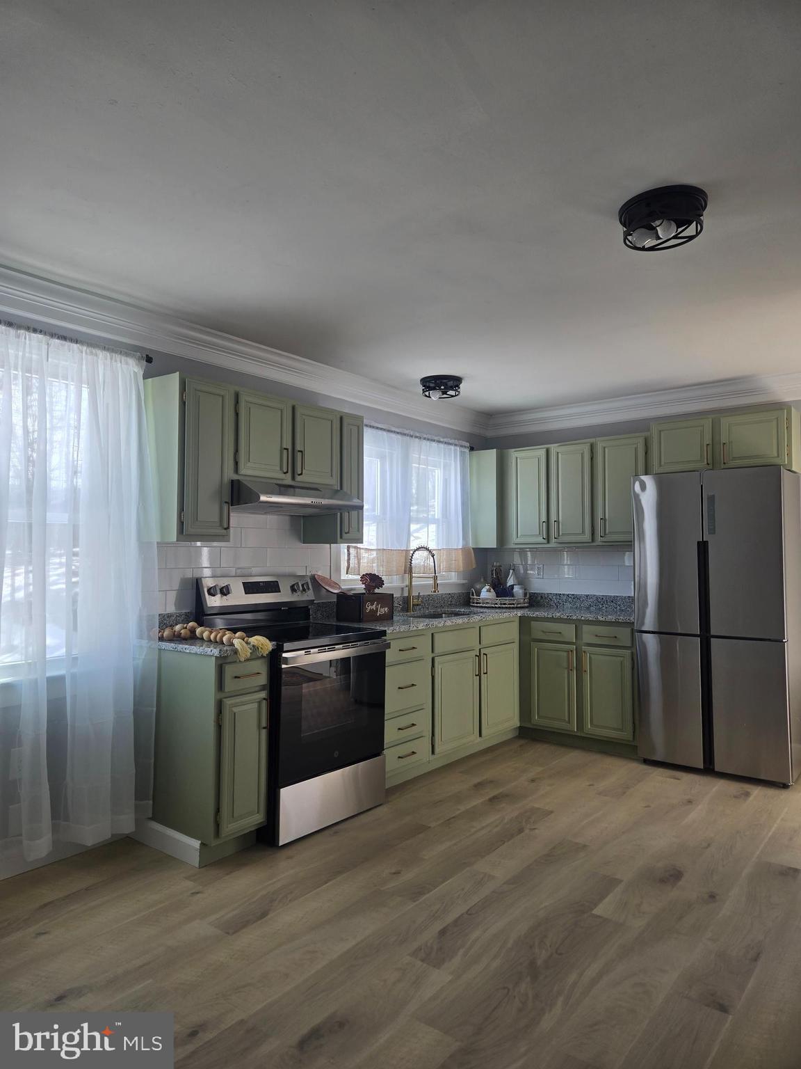 975 Williams Street Cumberland, MD 21502 - Photo 8 of 33 a kitchen with a sink and stainless steel appliances