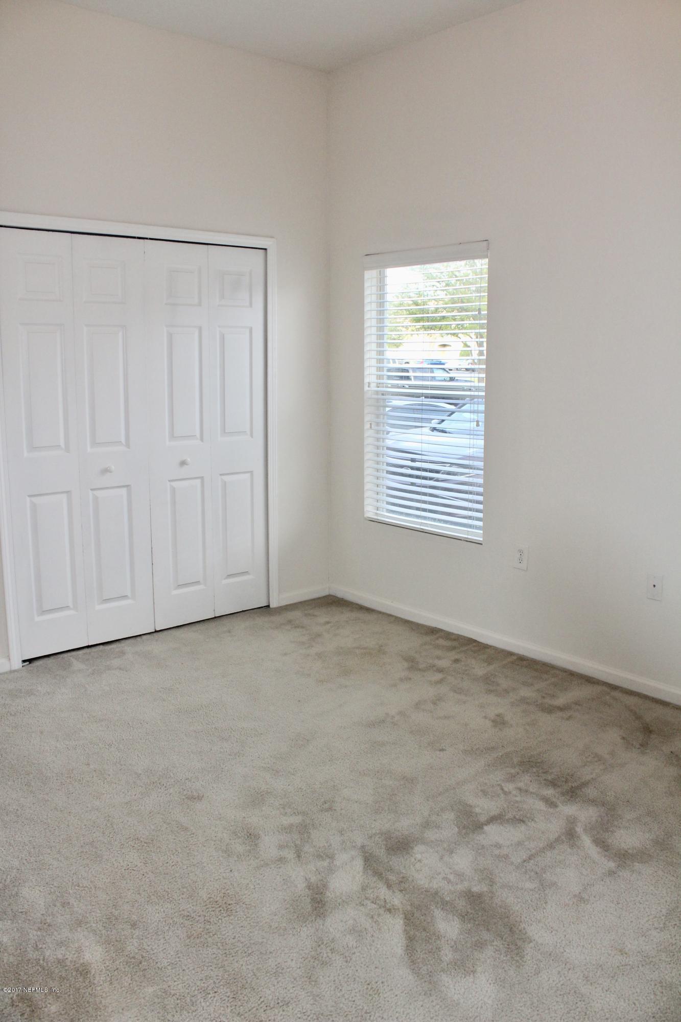 7920 Merrill Road, Unit 1705 Jacksonville, FL 32277 - Photo 11 of 25 an empty room with a window