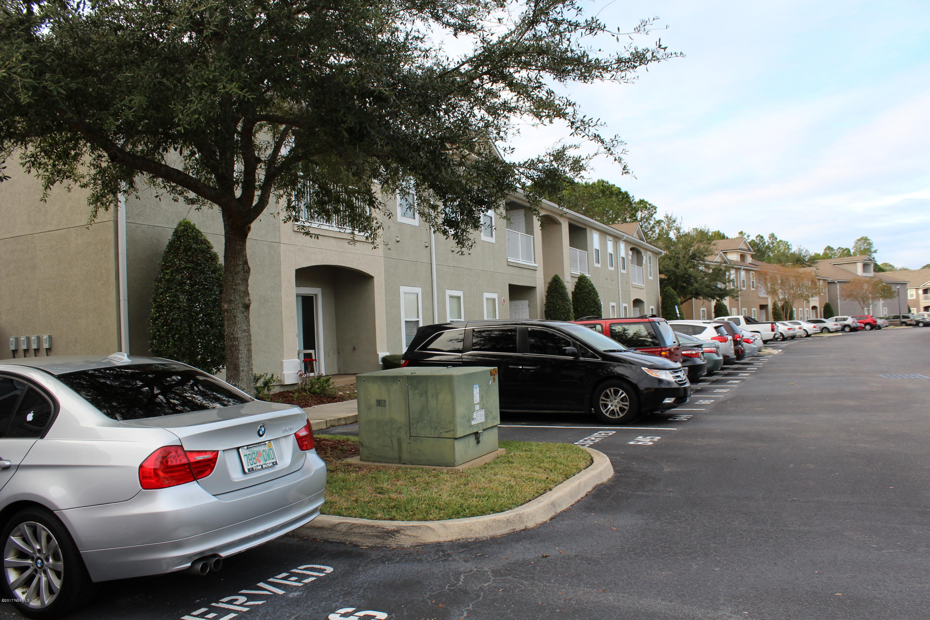 7920 Merrill Road, Unit 1705 Jacksonville, FL 32277 - Photo 21 of 25 a car parked in front of a house