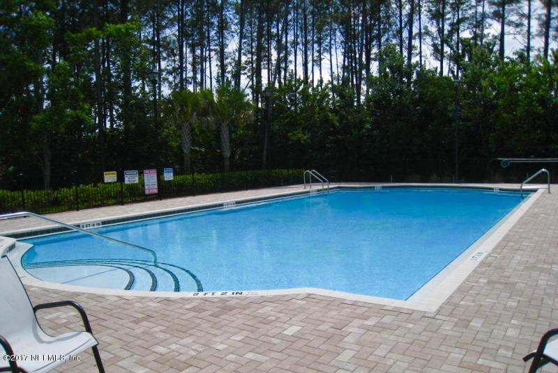 7920 Merrill Road, Unit 1705 Jacksonville, FL 32277 - Photo 24 of 25 a view of a swimming pool with a patio