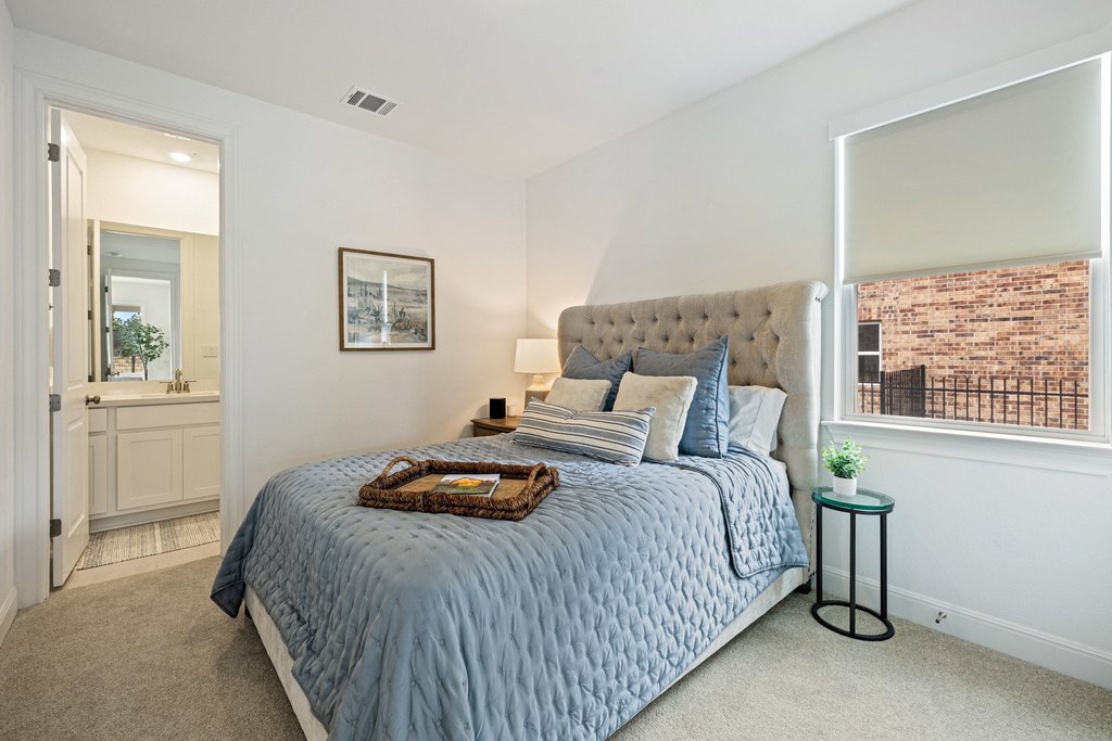 365 Pear Tree Lane Austin, TX 78737 - Photo 25 of 39 a bedroom with a bed and a window