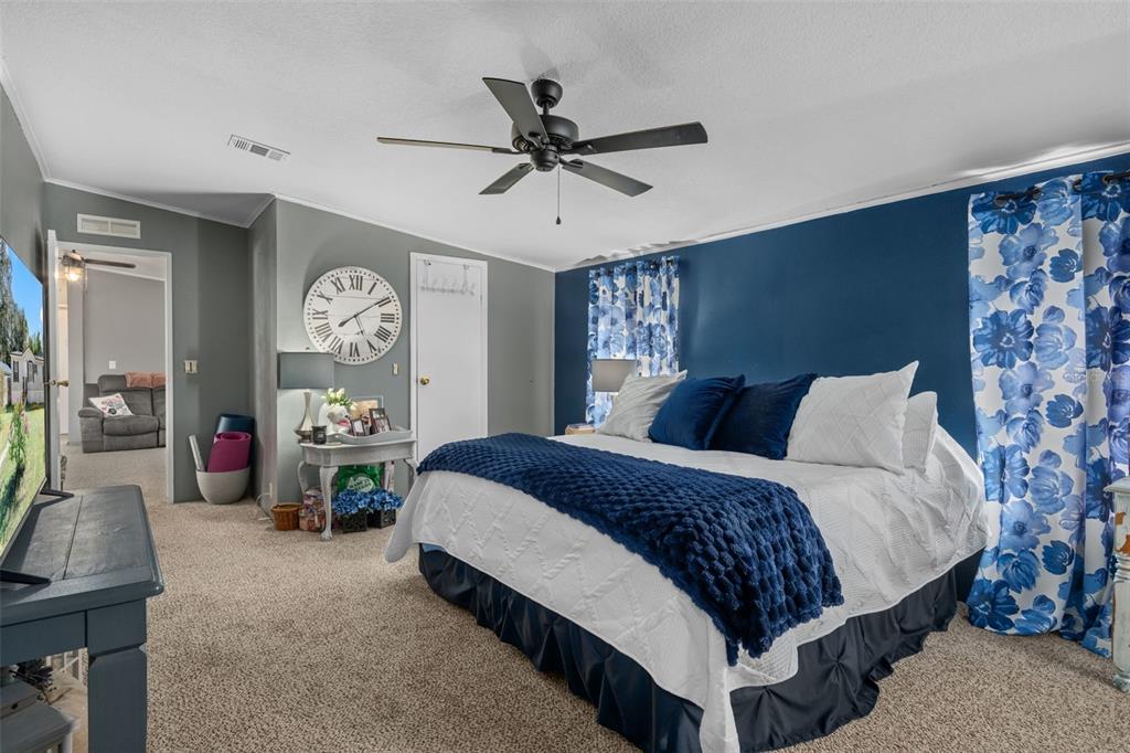 460 Korbus Road Brooksville, FL 34604 - Photo 12 of 22 a bedroom with a bed couch and a window