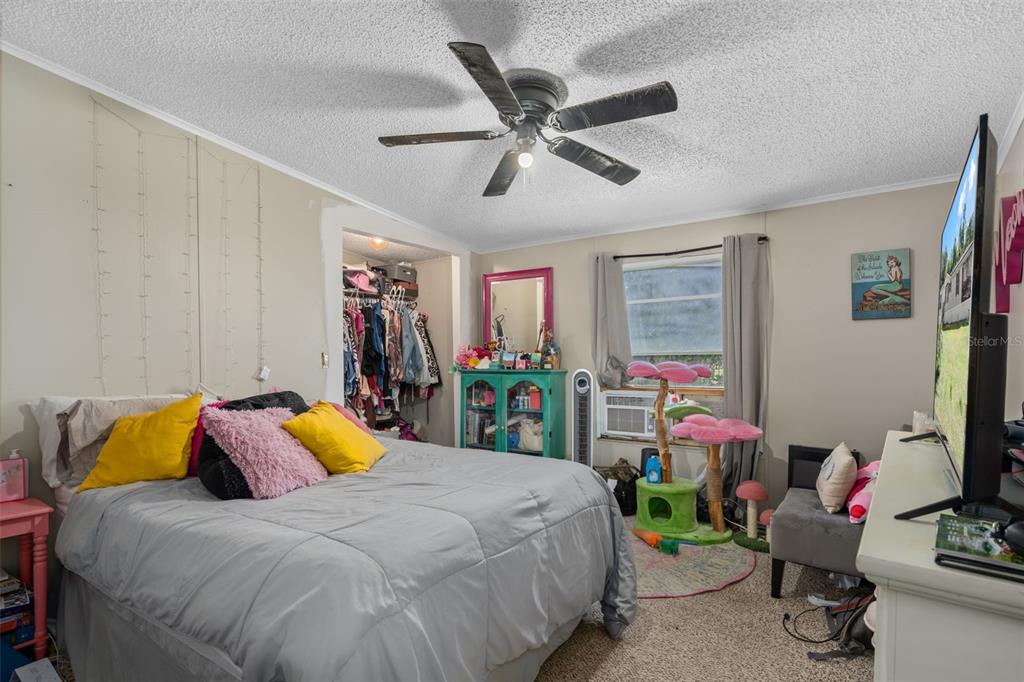 460 Korbus Road Brooksville, FL 34604 - Photo 16 of 22 a bed room with a bed and a window