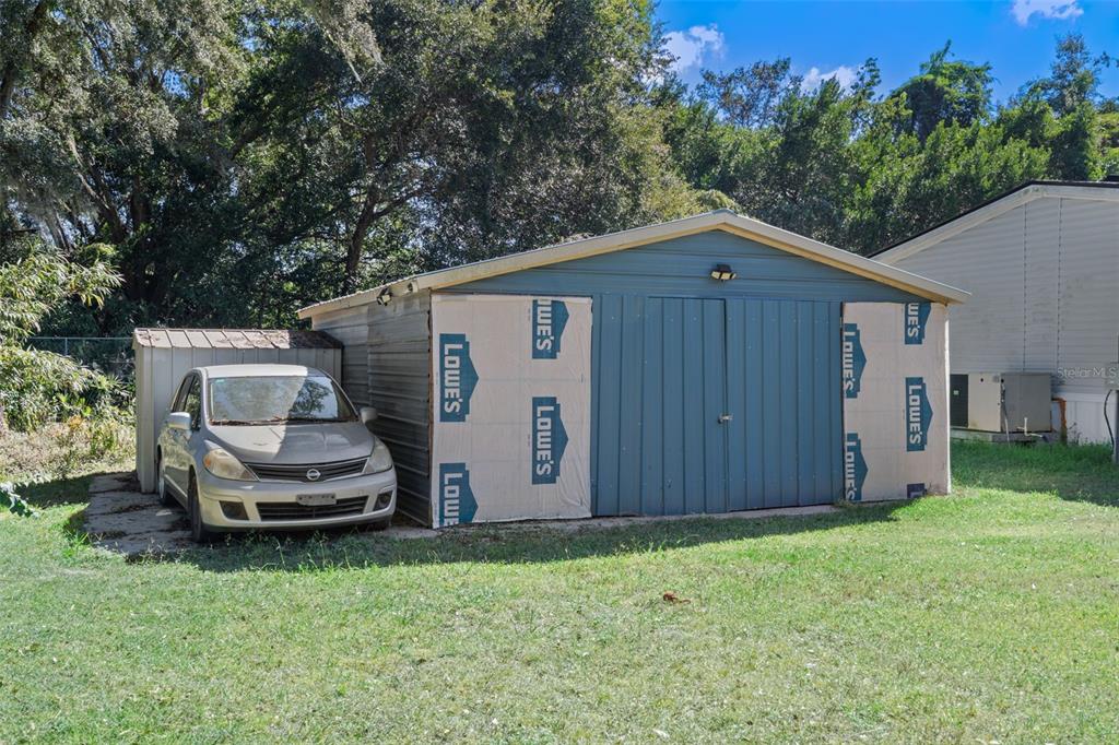 460 Korbus Road Brooksville, FL 34604 - Photo 18 of 22 a wooden bench sitting in front of a house