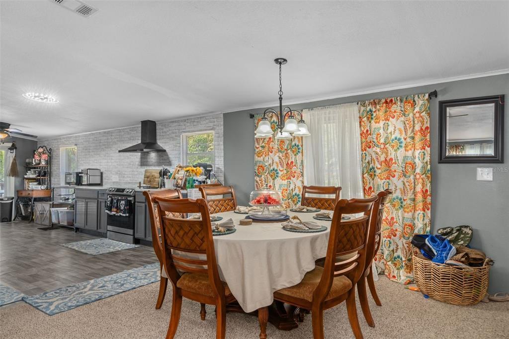 460 Korbus Road Brooksville, FL 34604 - Photo 4 of 22 a view of a dining room with furniture window and outside view