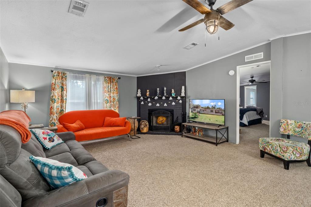 460 Korbus Road Brooksville, FL 34604 - Photo 6 of 22 a bedroom with furniture and a flat screen tv