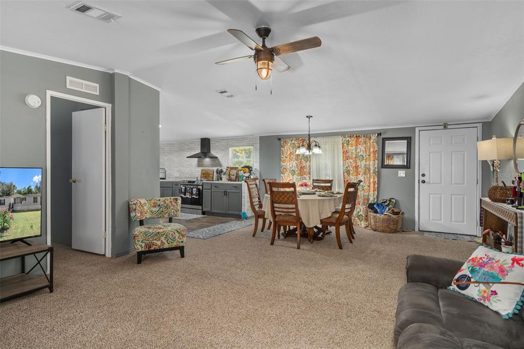 460 Korbus Road Brooksville, FL 34604 - Photo 8 of 22 a living room with furniture and a large window