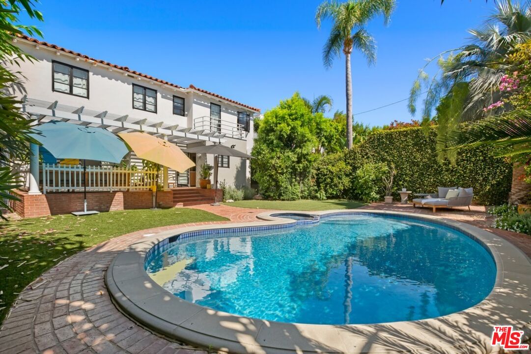 232 South Rodeo Drive Beverly Hills, CA 90212 - Photo 1 of 14 a view of a house with a swimming pool