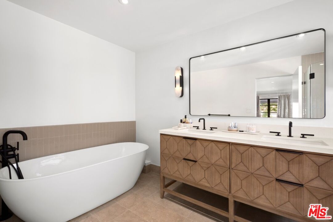 232 South Rodeo Drive Beverly Hills, CA 90212 - Photo 13 of 14 a bathroom with a bathtub and a sink