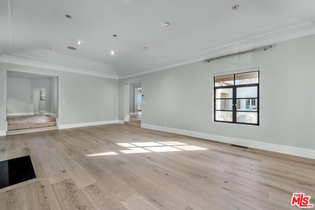 232 South Rodeo Drive Beverly Hills, CA 90212 - Photo 3 of 14 a view of empty room with wooden floor and fan