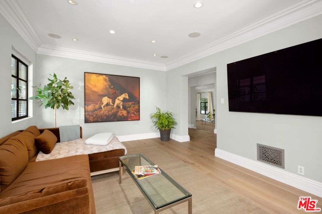 232 South Rodeo Drive Beverly Hills, CA 90212 - Photo 6 of 14 a living room with furniture and a flat screen tv