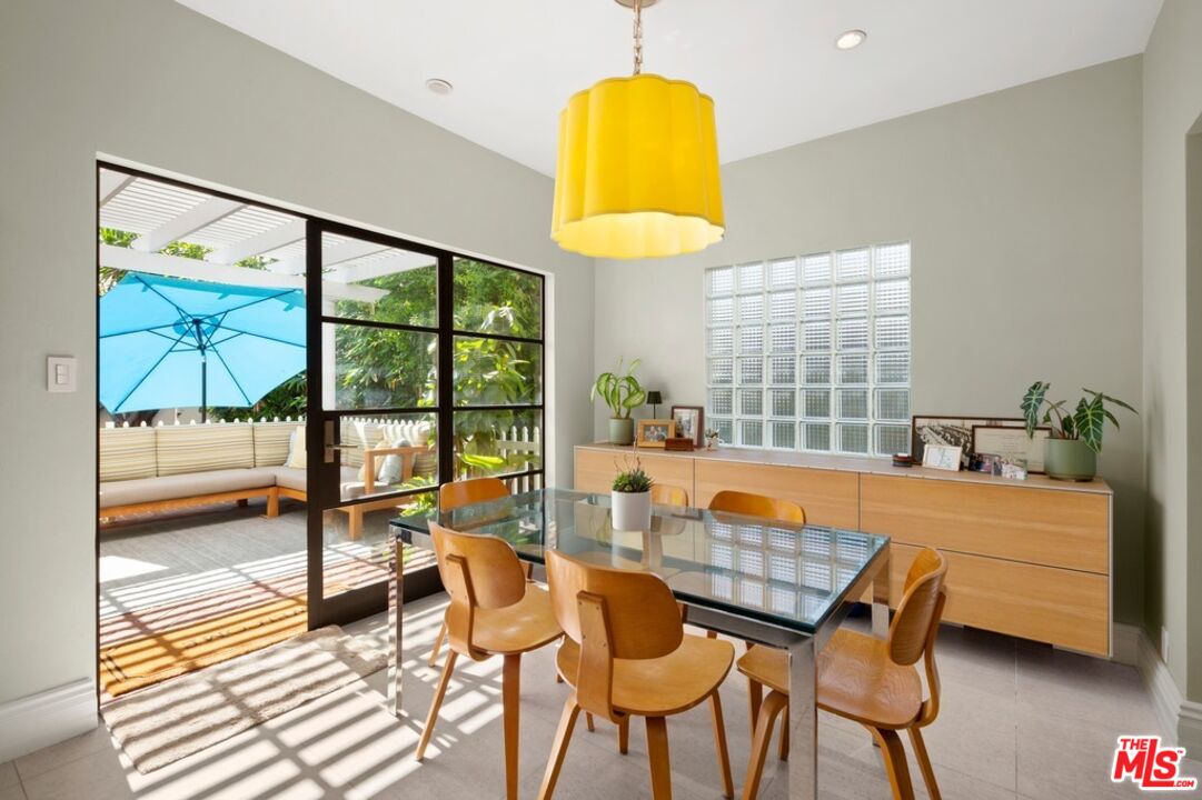 232 South Rodeo Drive Beverly Hills, CA 90212 - Photo 7 of 14 a table and chairs in a room