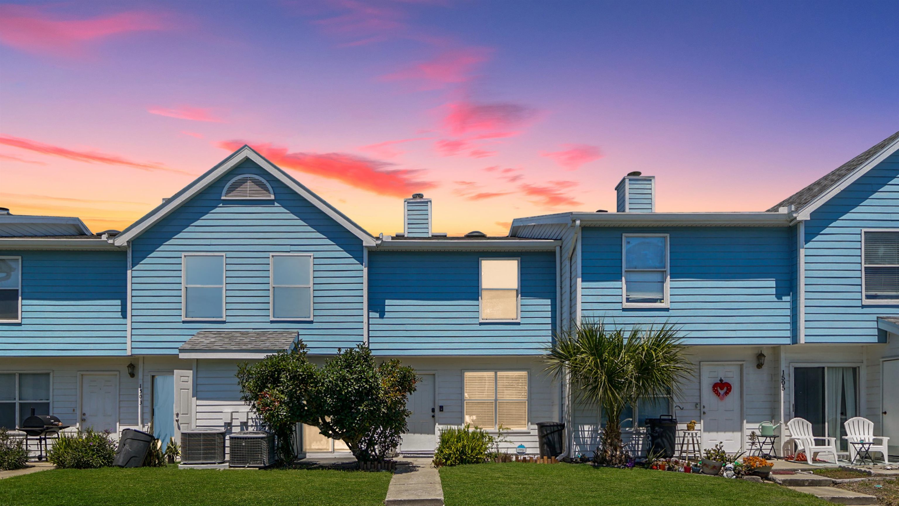 a front view of a house with garden