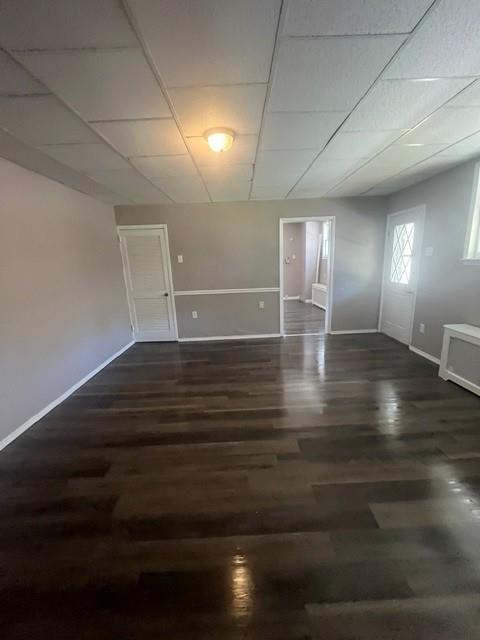 126 East High Street Coaldale, PA 18218 - Photo 7 of 15 Rich wood flooring stretches across this versatile open-plan living space.