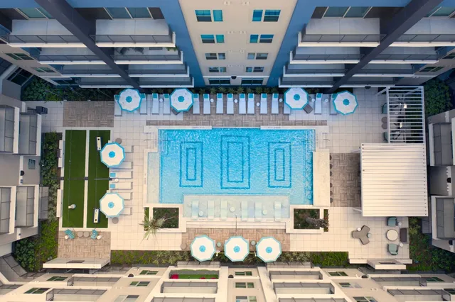 a view of a patio with a table and chairs