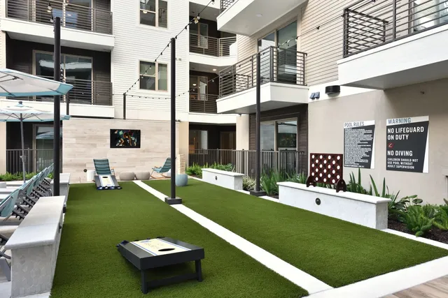 a view of a patio with couches chairs and potted plants