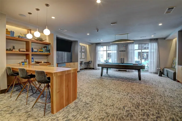 a living room with furniture and a rug