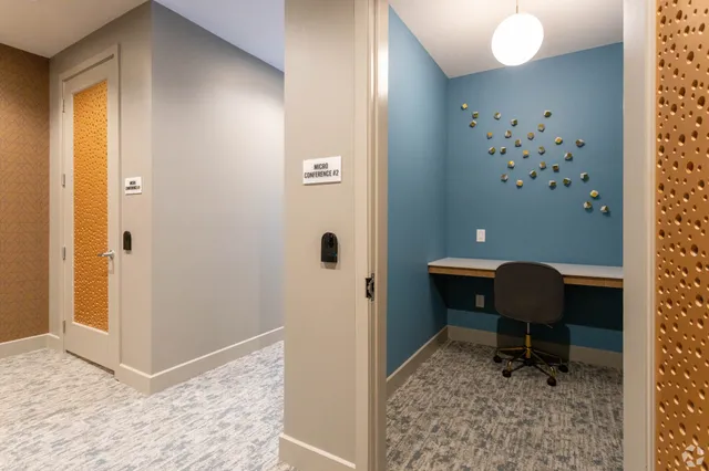 a dining room with furniture and a window