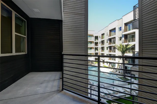 a view of a balcony with a potted plant