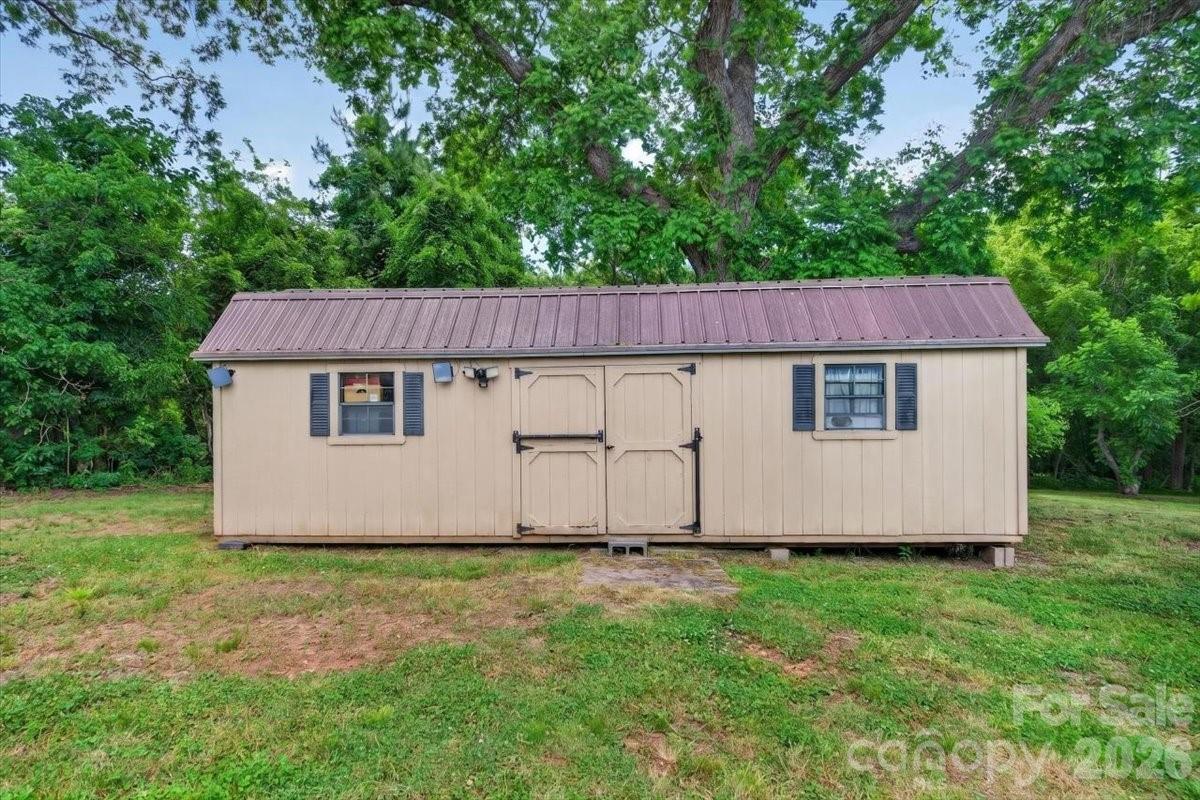 567 Godbey Road Mocksville, NC 27028 - Photo 24 of 38 a view of backyard with large tree and wooden fence