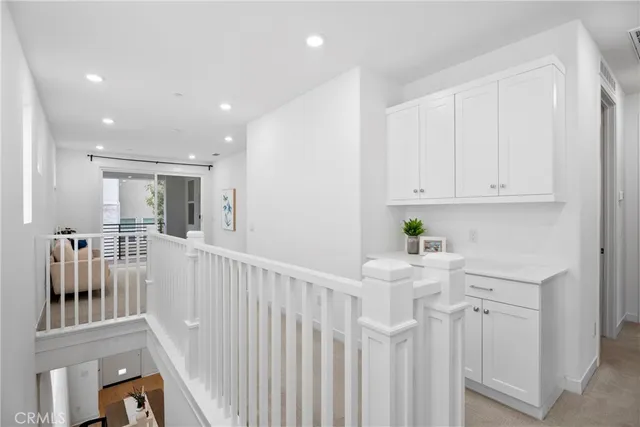 a view of kitchen with furniture and refrigerator