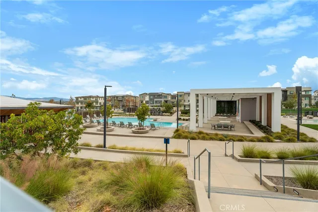 a view of a swimming pool with a lounge chair