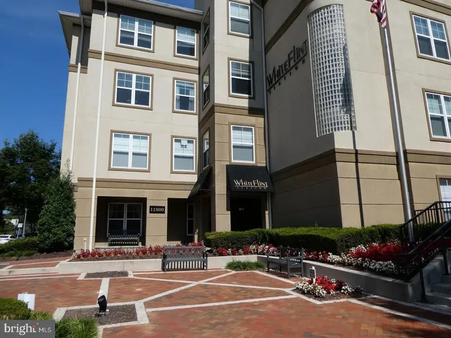 a front view of a building with street view