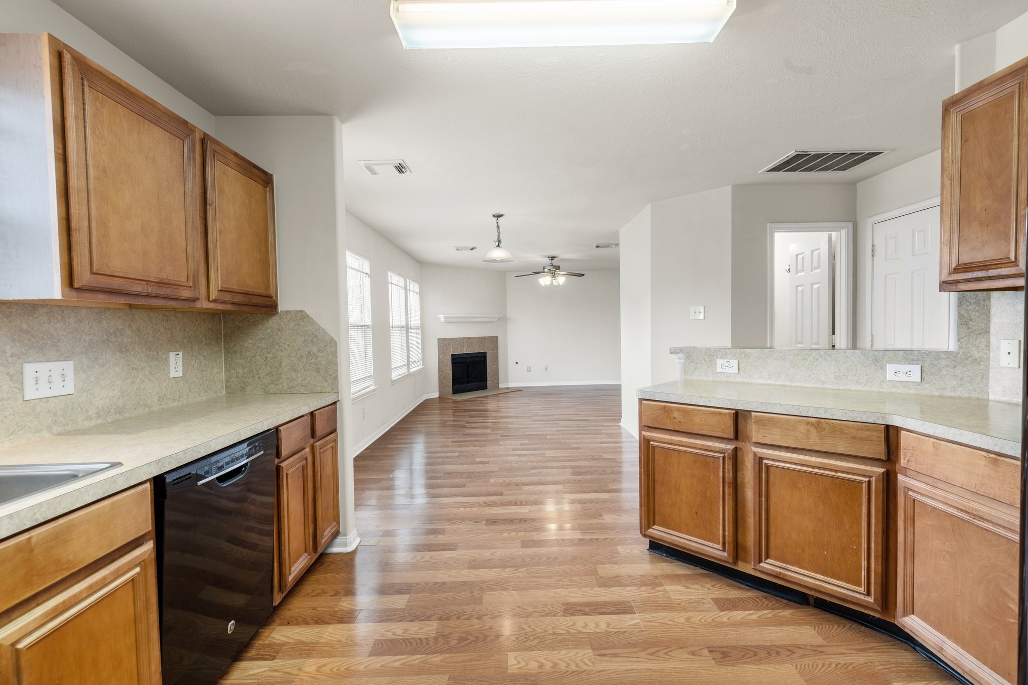 3111 Holly Ranch Drive Katy, TX 77494 - Photo 10 of 28 a large kitchen with stainless steel appliances granite countertop a sink and cabinets