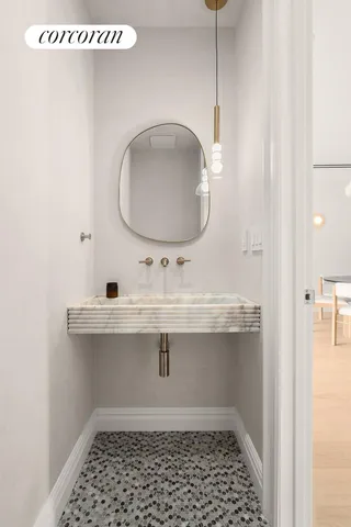 a bathroom with a sink a mirror and vanity