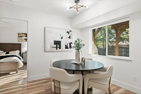 a living room with furniture potted plant and a window
