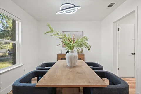 a table and a vase with flowers on it
