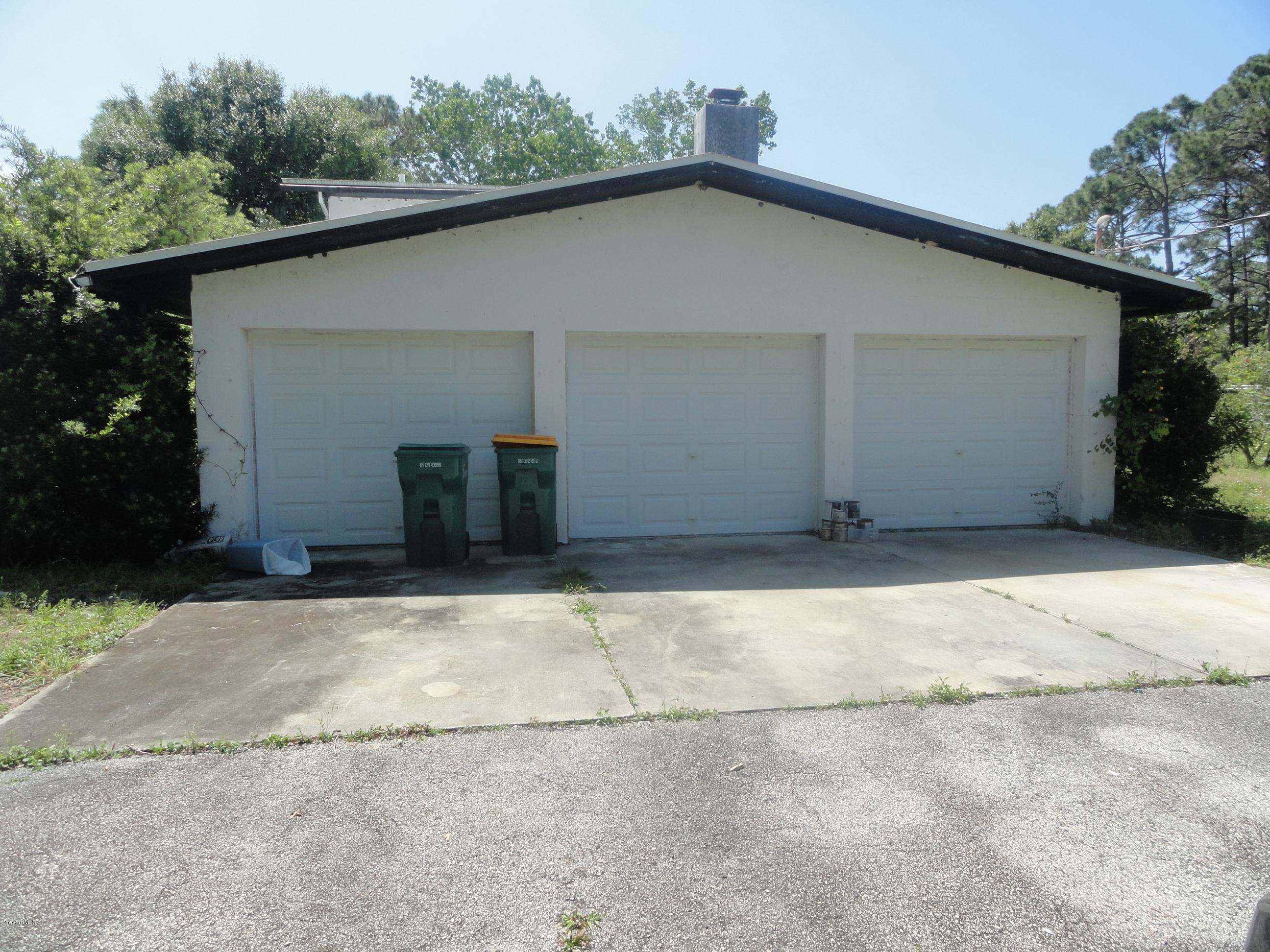 4350 Pinewood Road Melbourne, FL 32934 - Photo 40 of 43 3 CAR GARAGE- DRIVEWAY
