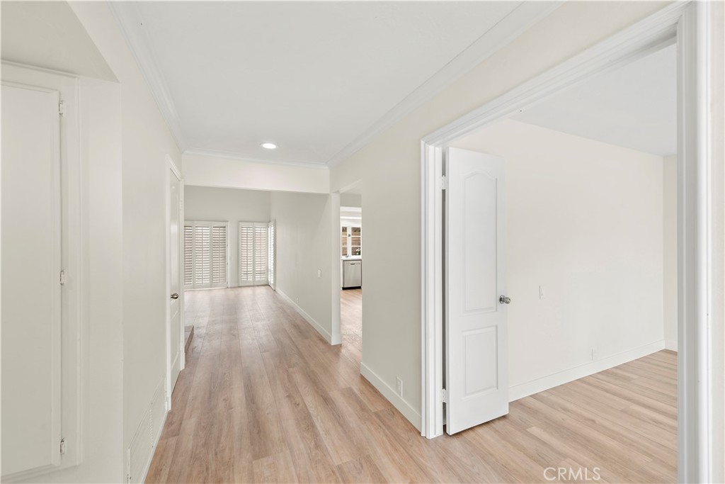 23892 Taranto Bay Dana Point, CA 92629 - Photo 11 of 54 a view of a hallway with wooden floor