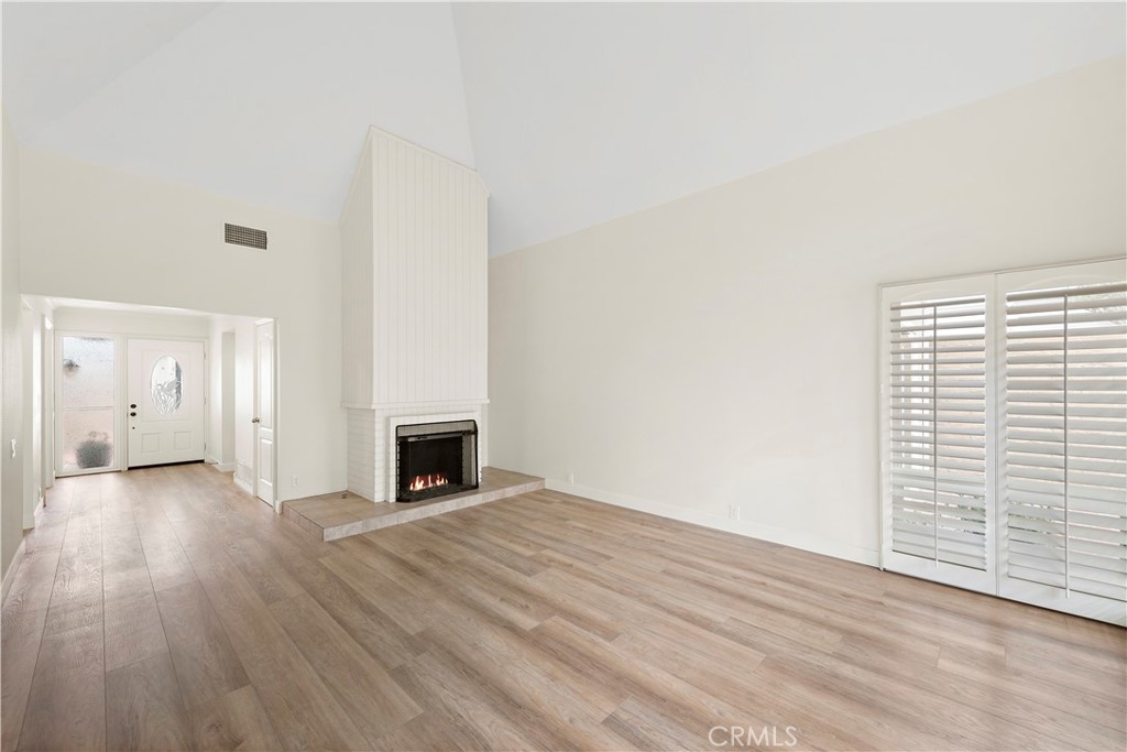 23892 Taranto Bay Dana Point, CA 92629 - Photo 13 of 54 a view of a livingroom with wooden floor and a fireplace