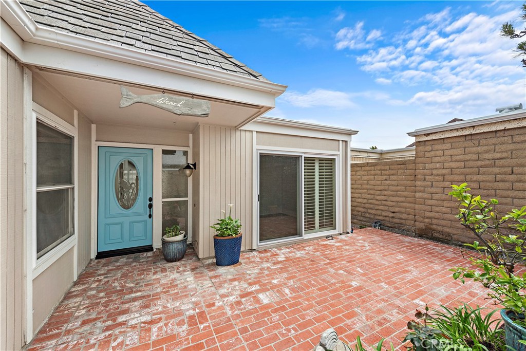 23892 Taranto Bay Dana Point, CA 92629 - Photo 27 of 54 a view of a front door with potted plants