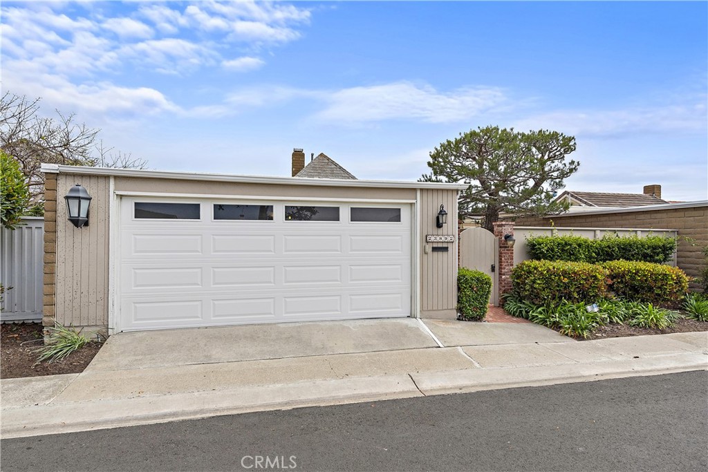 23892 Taranto Bay Dana Point, CA 92629 - Photo 36 of 54 a front view of a house with a yard and garage