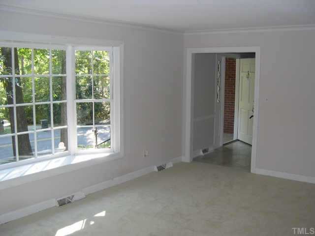 4201 Oak Park Road Raleigh, NC 27612 - Photo 5 of 12 an empty room with a window