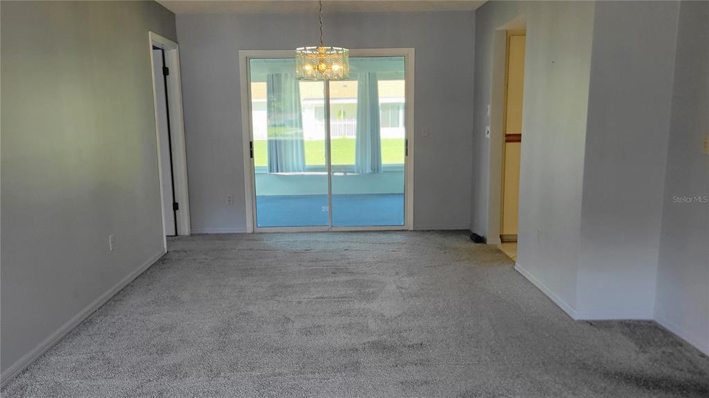 11215 Southwest 63rd Terrace Road Ocala, FL 34476 - Photo 5 of 13 an empty room with windows