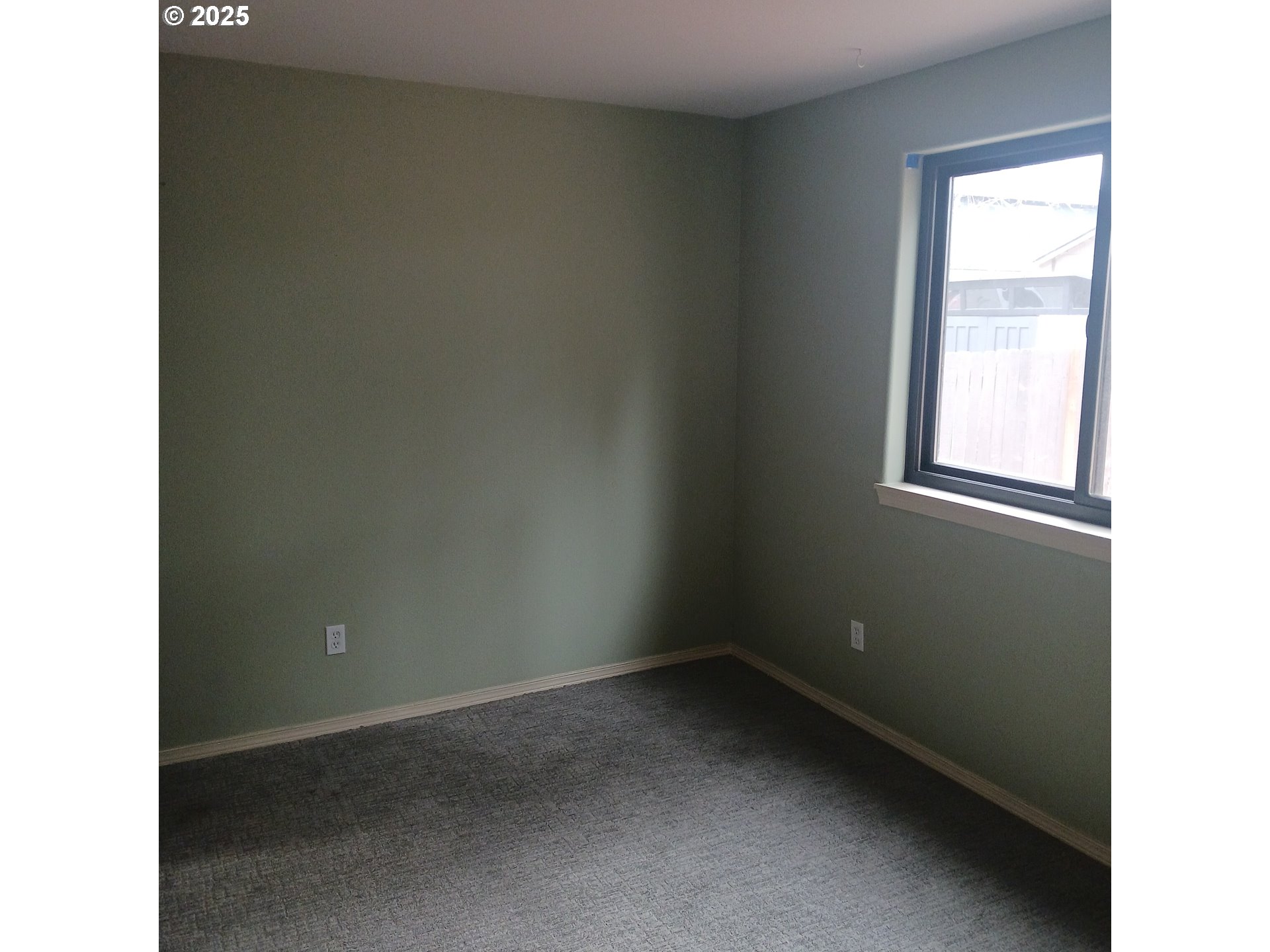 3151 Northeast Wells Acres Road Bend, OR 97701 - Photo 3 of 16 a view of an empty room with a window