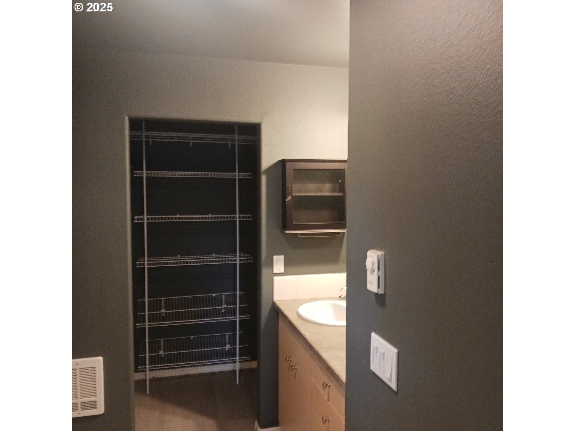 3151 Northeast Wells Acres Road Bend, OR 97701 - Photo 5 of 16 a kitchen with a refrigerator and a sink