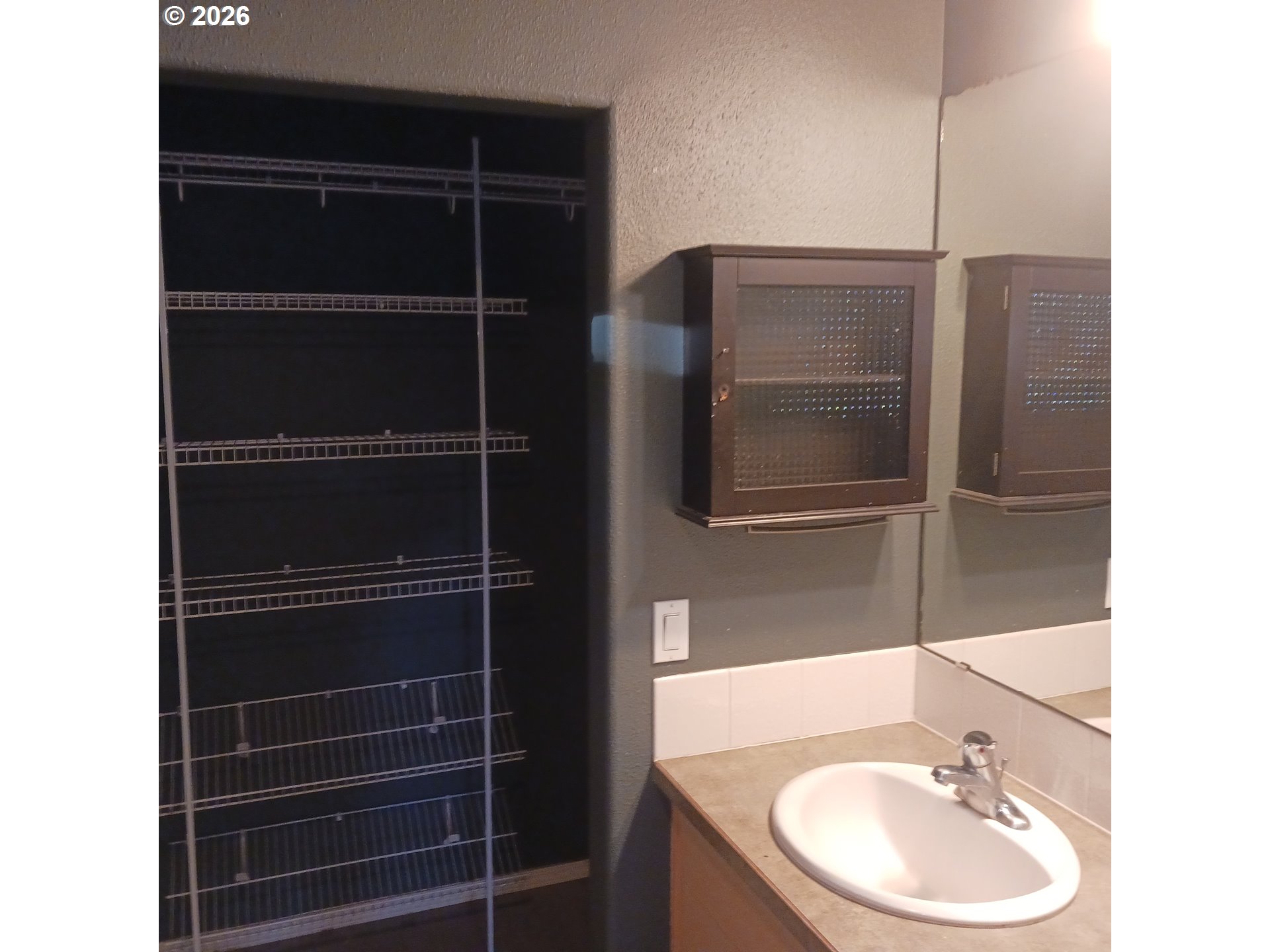 3151 Northeast Wells Acres Road Bend, OR 97701 - Photo 10 of 16 a bathroom with a sink and a mirror