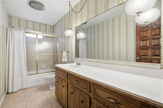 a bathroom with a sink a vanity and a mirror