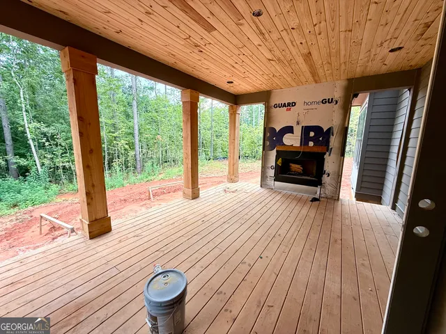 a view of a livingroom with furniture window and wooden floor