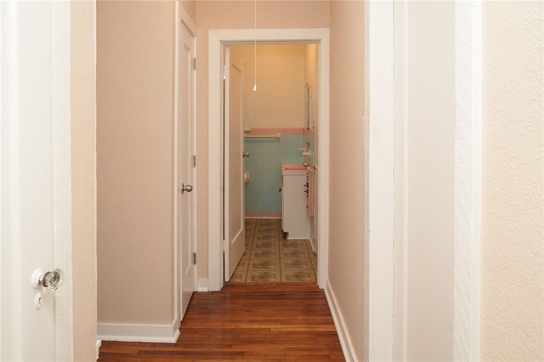 641 Naples Street Corpus Christi, TX 78404 - Photo 15 of 29 a view of a hallway with wooden floor