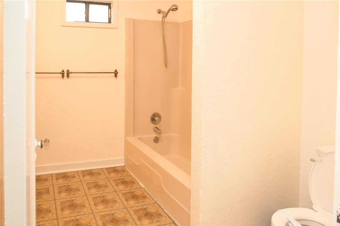 641 Naples Street Corpus Christi, TX 78404 - Photo 17 of 29 a bathroom with a shower and a toilet