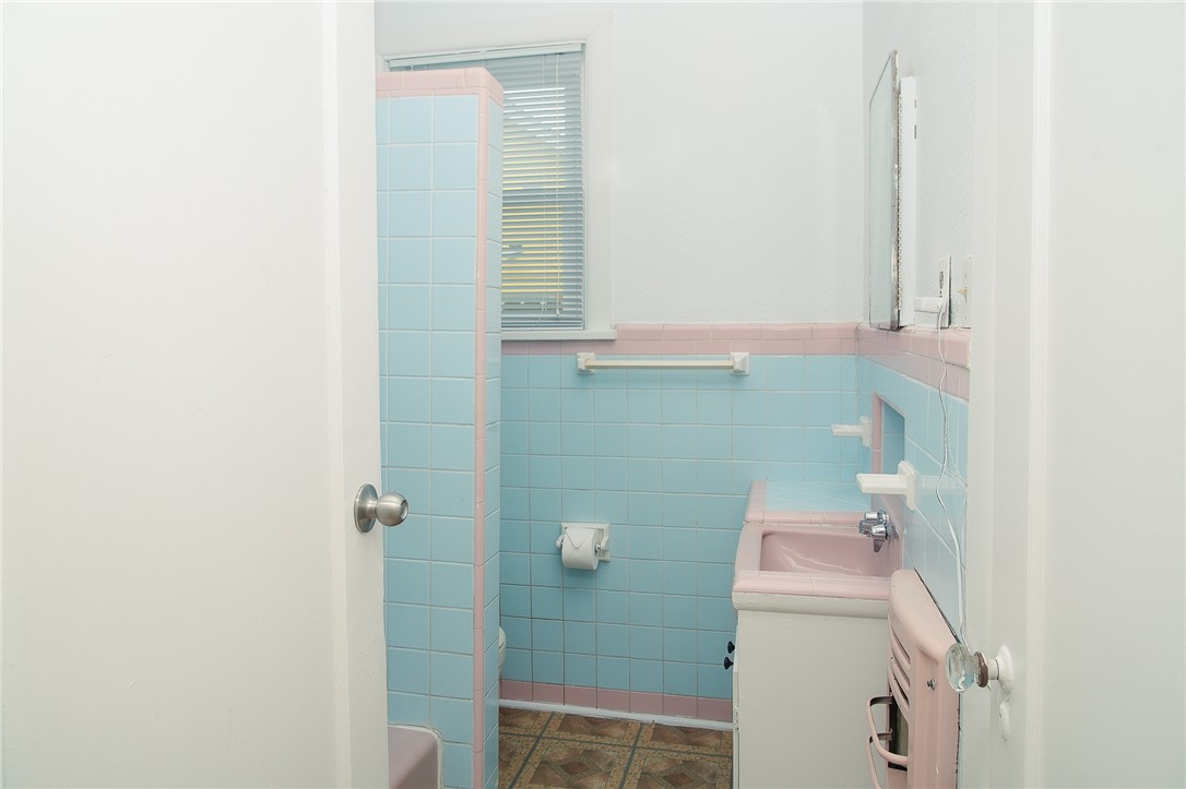 641 Naples Street Corpus Christi, TX 78404 - Photo 18 of 29 a bathroom with a sink and toilet